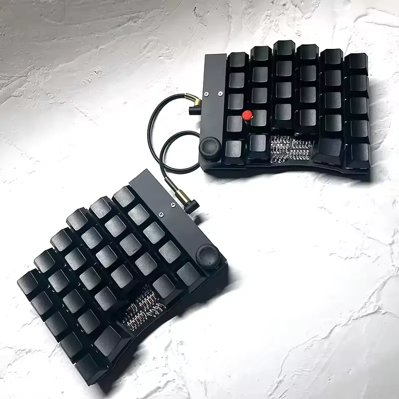 image of do52, number row, hat switch on both sides, and trackpoint on right-hand side between keys